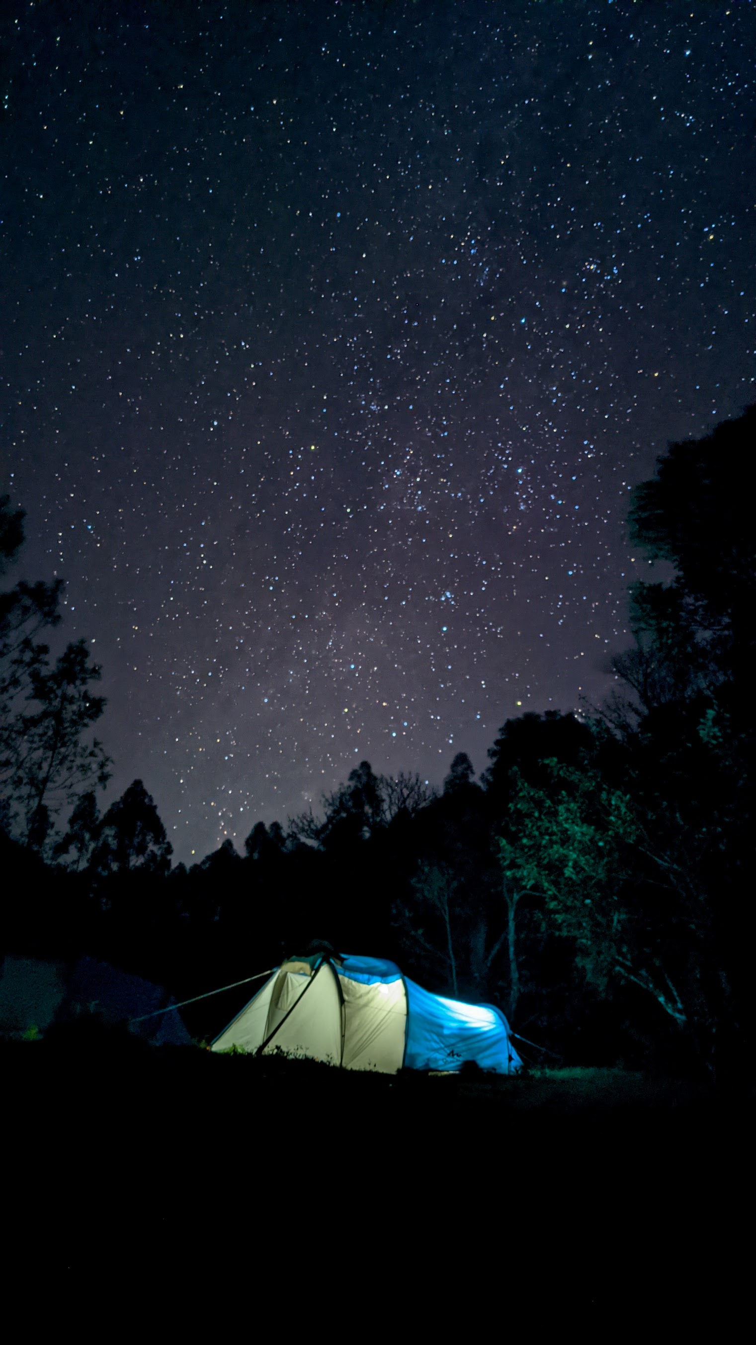 Glowing tent under the Milky Way at Magic Valley, Vattavada