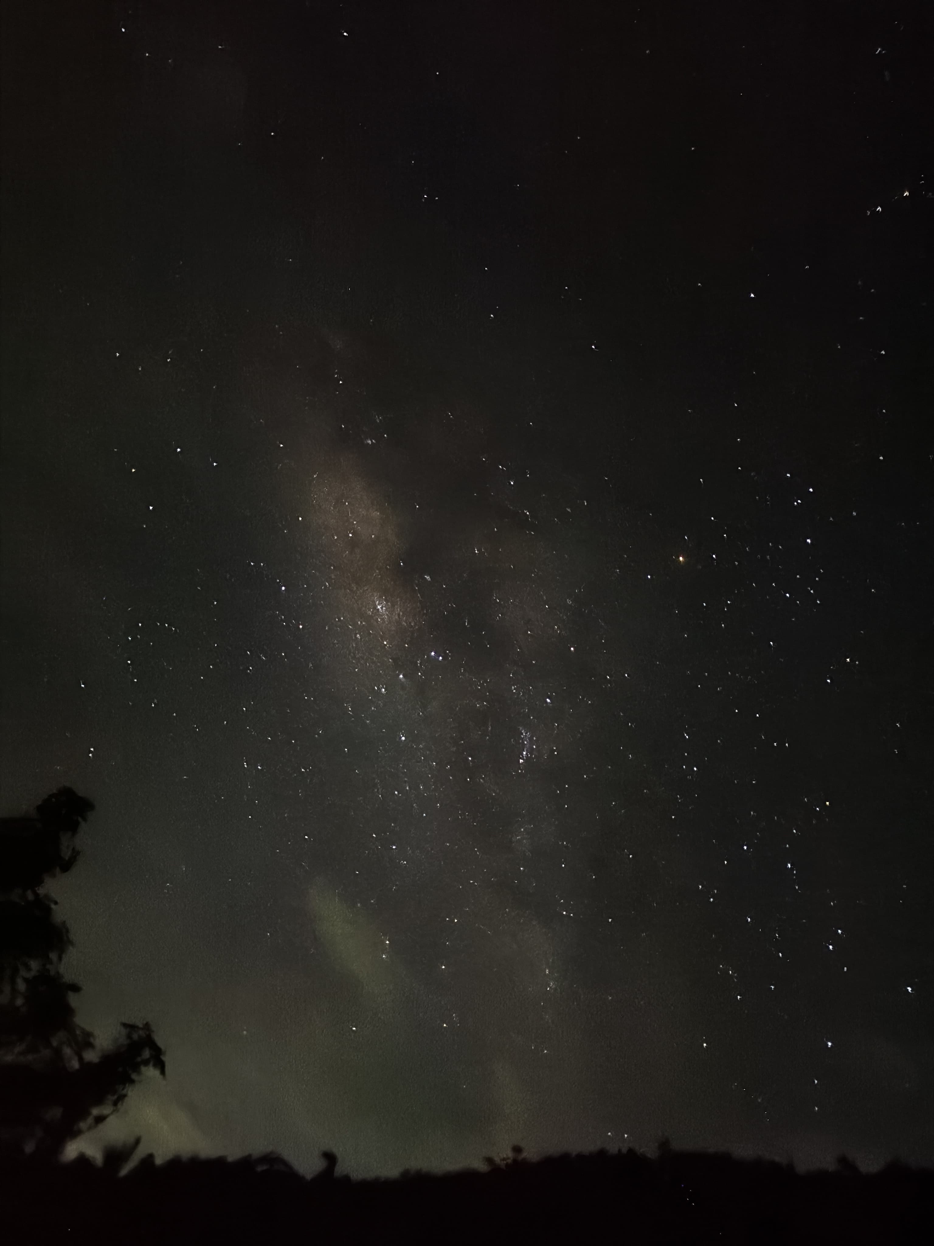 Mudhouse kitchen glowing under the Milky Way at Magic Valley